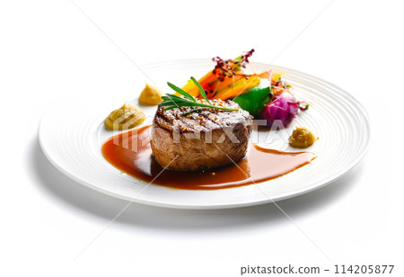 Grilled beef steak and plate of colorful vegetables isolated on white background 114205877