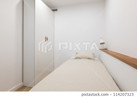 Soft bed with pillow and wardrobe in white color bedroom Soft bed with pillow and wardrobe in white color bedroom 114207323