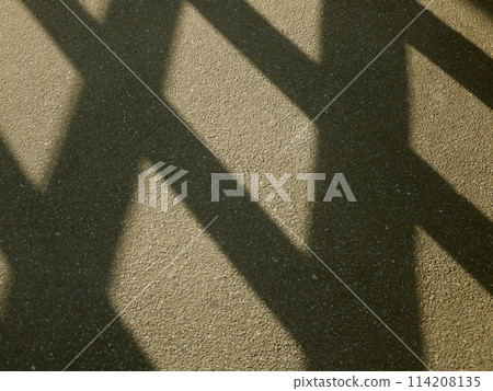 Shadow of the lattice reflected on the concrete Shadow of the lattice reflected on the concrete 114208135