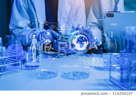 Medical or research scientist or doctor using looking at a test tube of clear solution in a lab or laboratory. Medical or research scientist or doctor using looking at a test tube of clear solution in a lab or laboratory. 114208187