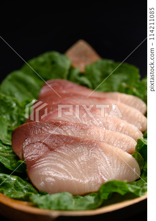 Shime Saba or raw mackerel salted and marinated in vinegar on black plate. Japanese food style Shime Saba or raw mackerel salted and marinated in vinegar on black plate. Japanese food style 114211085