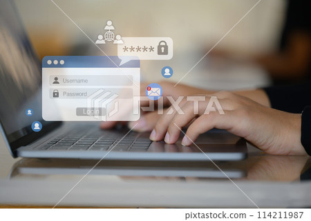 Woman hands typing username and password on her laptop to access account on website Woman hands typing username and password on her laptop to access account on website 114211987