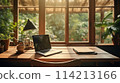 Laptop on window table with lush garden view 114213166