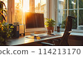 Computer on window table with lush garden view 114213170