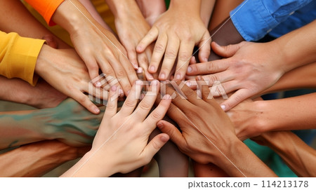 Hands unite in circle, blending diversity and symbolizing unity 114213178