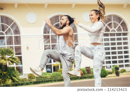Happy Couple Exercising In Park Happy Couple Exercising In Park 114213423