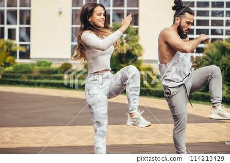 Happy Couple Exercising In Park Happy Couple Exercising In Park 114213429
