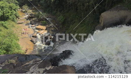 Slow Motion of Waterfall in Jungle with People Bathing Slow Motion of Waterfall in Jungle with People Bathing 114215129