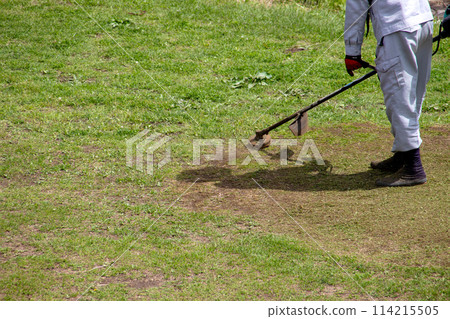 Men who are mowing Men who are mowing 114215505