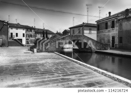 Walking among the picturesque canals of Comacchio, Italy Walking among the picturesque canals of Comacchio, Italy 114216724