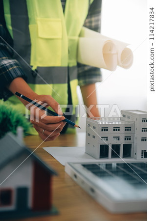 Wind energy engineer designing and developing project for residential district 114217834