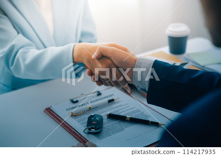 Insurance officers hand over the car keys after the tenant. have signed an auto insurance document or a lease or agreement document Buying or selling a new or used car with a car Insurance officers hand over the car keys after the tenant. have signed an auto insurance document or a lease or agreement document Buying or selling a new or used car with a car 114217935