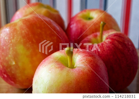 Dew-Kissed Apples. Fresh apples with dew, vibrant on a wooden surface. Uses for Food blogs, health articles. Dew-Kissed Apples. Fresh apples with dew, vibrant on a wooden surface. Uses for Food blogs, health articles. 114218031