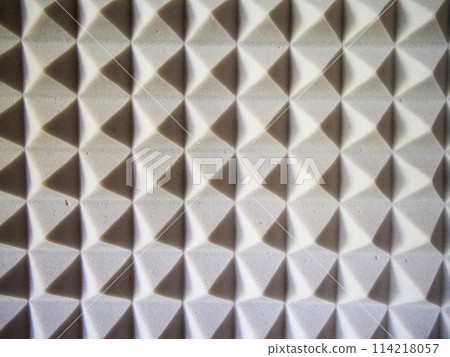 Sound Insulation Foam. Close-up of grey, pyramid-shaped acoustic foam. 114218057