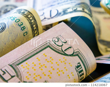 Currency Display. A mix of rolled and unrolled dollar notes. Currency Display. A mix of rolled and unrolled dollar notes. 114218067