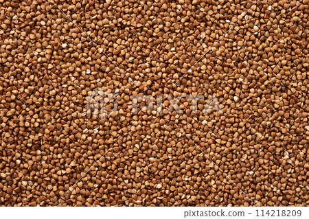 Buckwheat groats texture background. Organic food raw dry. Buckwheat grains. 114218209