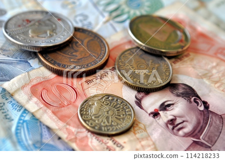 A vivid pile of Indian rupee notes and coins showcasing the nations financial diversity and richness. 114218233