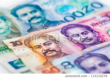 An artistic arrangement of stacked Indian currency notes creating a pile, showcasing wealth and financial abundance. An artistic arrangement of stacked Indian currency notes creating a pile, showcasing wealth and financial abundance. 114218236