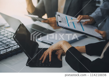 Finance manager meeting discussing company growth project success financial statistics, professional investor working start up project for strategy plan with document, laptop and digital tablet. 114218836