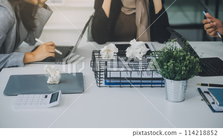 Stressful business man have so many paperwork in the office Stressful business man have so many paperwork in the office 114218852