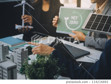 Green energy business company meeting with business people planning and discuss marketing of sustainable and renewable clean energy product with solar cell and wind turbine generator. Trailblazing 114218891