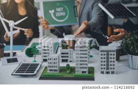 Green energy business company meeting with business people planning and discuss marketing of sustainable and renewable clean energy product with solar cell and wind turbine generator. Trailblazing 114218892