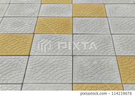 Pattern grey yellow paving slabs floor road surface street city background texture tile abstract backdrop 114219078