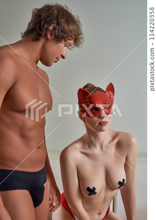 Sexy couple in role playing game at home Sexy couple in role playing game at home 114220358