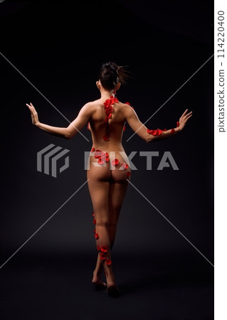 Naked woman in underwear standing in studio Naked woman in underwear standing in studio 114220400