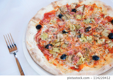 delicious pizza on white table delicious pizza on white table 114220412