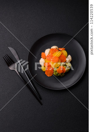Delicious fresh vegetables broccoli, cauliflower, carrots steamed with salt 114220539