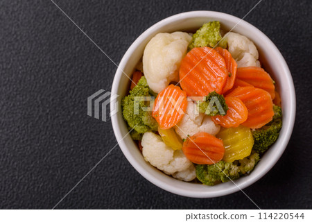 Delicious fresh vegetables broccoli, cauliflower, carrots steamed with salt 114220544