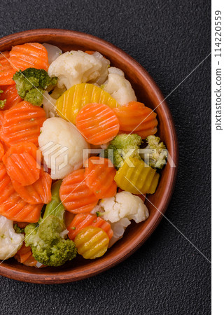 Delicious fresh vegetables broccoli, cauliflower, carrots steamed with salt 114220559