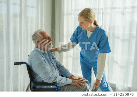 Help support retirement healthcare. Nurse helping old man in wheelchair. Patient and woman in nursing home for medical caregiver. Nurse taking care of paralyzed man in chair for people with disability Help support retirement healthcare. Nurse helping old man in wheelchair. Patient and woman in nursing home for medical caregiver. Nurse taking care of paralyzed man in chair for people with disability 114220976