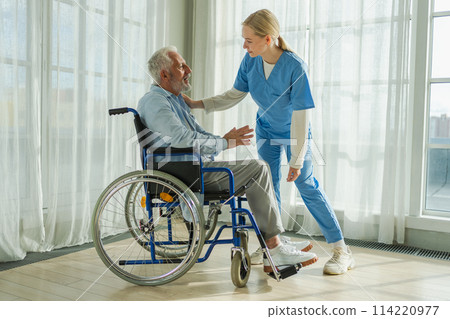 Help support retirement healthcare. Nurse helping old man in wheelchair. Patient and woman in nursing home for medical caregiver. Nurse taking care of paralyzed man in chair for people with disability 114220977