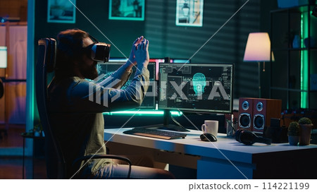 Ecstatic man celebrating after awakening AI using VR headset, making it ask existential questions. Happy developer excited to chat with artificial intelligence using virtual reality tech, camera A 114221199