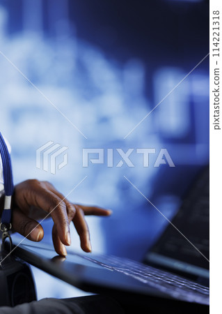 IT consultant writes code on tablet to visualize artificial intelligence neural networks using augmented reality, close up. High tech establishment manager runs AI script for information processing 114221318
