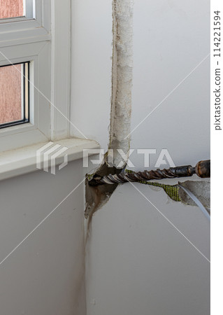 Technician of the air conditioning system is drilling Lviv Ukraine 08.04.24 114221594