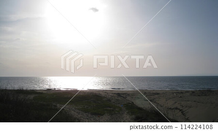 The sunlit Sea of Japan and sandy beach The sunlit Sea of Japan and sandy beach 114224108