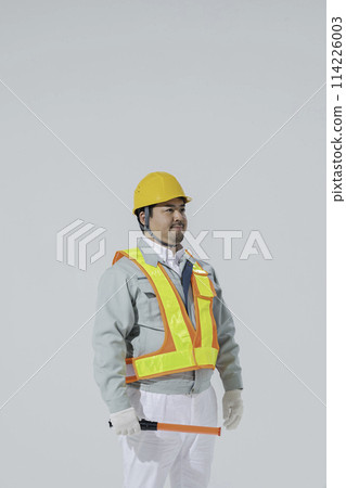 A large Japanese man wearing work clothes A large Japanese man wearing work clothes 114226003