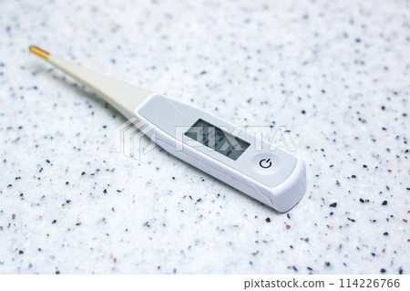 a digital thermometer shows a temperature of 40.1 degrees celsius 114226766