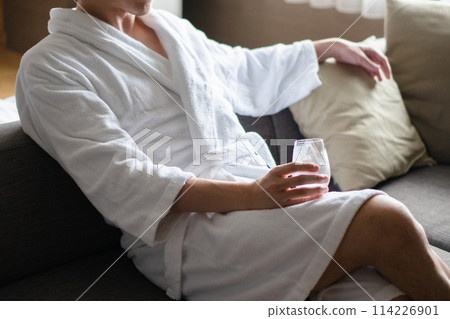Man wearing a bathrobe 114226901
