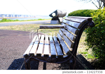 Bench with a river view Bench with a river view 114227338