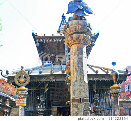 Vishnu temple and stone pillar in Bhaktapur, Kathmandu, Nepal Vishnu temple and stone pillar in Bhaktapur, Kathmandu, Nepal 114228164