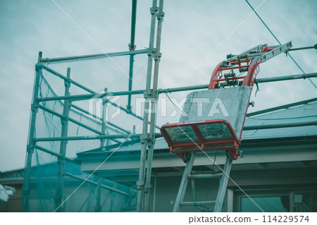 Tile lifting machine at a construction site Tile lifting machine at a construction site 114229574