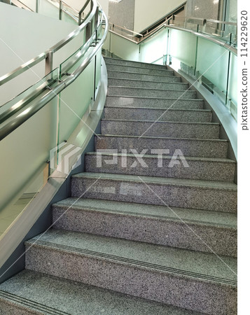 Spiral staircase  for walking up and down the building 114229620