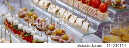 Banner assorted Gourmet Canapes on Glass Serving Tray. Banner assorted Gourmet Canapes on Glass Serving Tray. 114230154