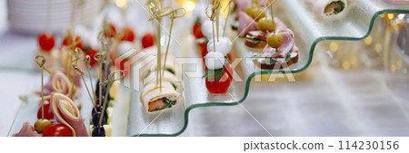 Banner assorted Gourmet Canapes on Glass Serving Tray. Banner assorted Gourmet Canapes on Glass Serving Tray. 114230156