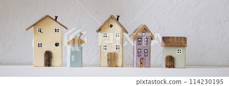 Banner wooden miniature houses on white shelf. Banner wooden miniature houses on white shelf. 114230195