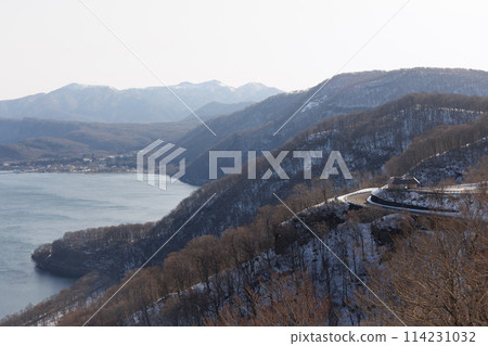 View of Lake Towada in winter and Hakko Pass No. 1 Observation Rest Area from Shimeitei Observatory (Kazuno City, Akita Prefecture) View of Lake Towada in winter and Hakko Pass No. 1 Observation Rest Area from Shimeitei Observatory (Kazuno City, Akita Prefecture) 114231032
